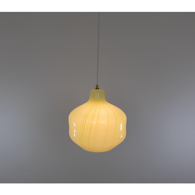Hand-blown glass pendant designed by Massimo Vignelli at the start of his impressive career in design and executed by...