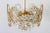 - Mid-Century Modern chandelier or pendant lamp - Manufactured by Palwa in the 1970s in Germany - Executed in gilt brass...