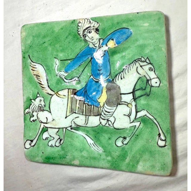 This antique hand-painted Middle Eastern pottery wall tile is a unique and authentic piece of decorative pottery. Handmade...