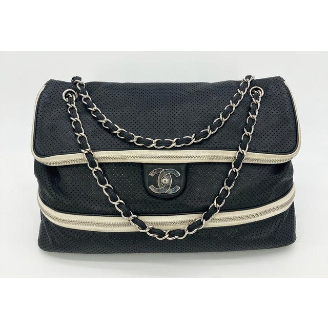 Chanel Black Perforated Leather Expandable Classic Flap Shoulder Bag in fair condition. Black perforated leather trimmed...