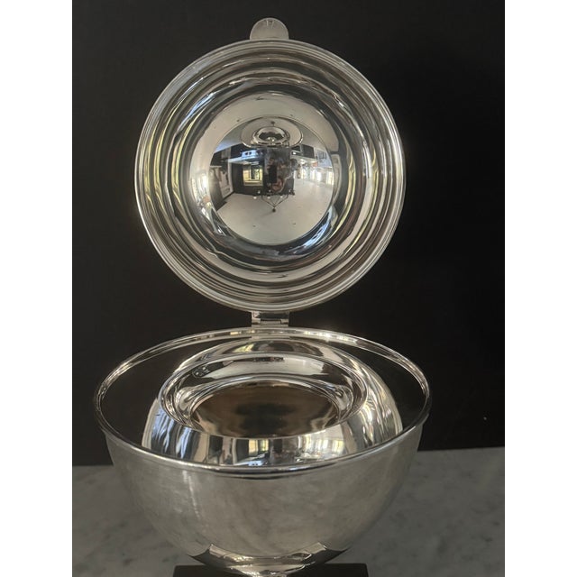 Vintage silver plate caviar server by St. James of vertical ovoid form on a tapered pedestal rising from a square foot....