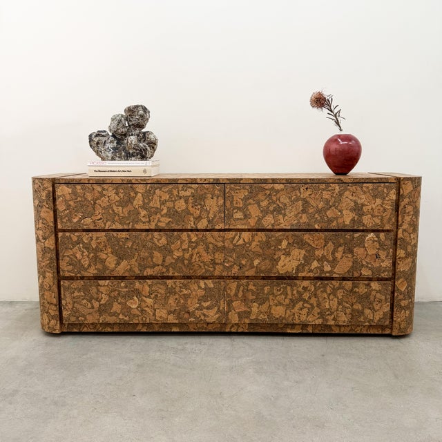 This dresser is made out of wood and cork with a matte finish. The drawers glide open and close smoothly, and the cork...