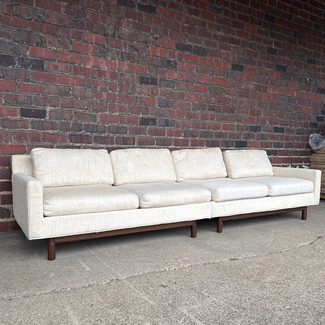 Mid-Century Modern two-piece sectional sofa by Selig Modern, dating to the 1960s. The sectional features a clean,...