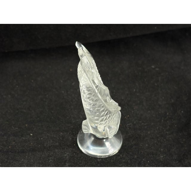 This elegant vintage Lalique crystal koi fish figurine captures the fluid grace of the koi in stunning detail. Crafted in...