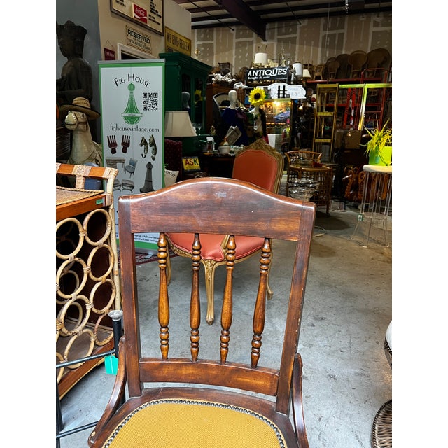Up for consideration is a beautiful antique bankers chair with nail head trim and wheels. This would look lovely in your...