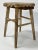 Antique primitive style wood stool. Sturdy construction. Heavy patina. Piece has been painted and since stripped....