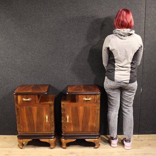 A pair of mid-20th-century Italian bedside tables. Carved and veneered in walnut, burl, cherry, beech, and fruitwood....