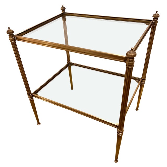 This pair of elegant two tier side tables were made in France in the 1960s. A stylish design with attractive finials and...