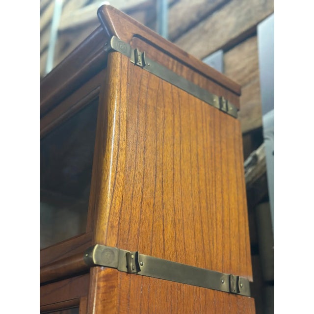 Rare barrister bookcase in big corner set. The piece features 6 columns of stacking bookcases of different sizes that...