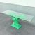 Striking boho chic console table featuring a sculptural banana leaf base in a bold green finish. The intricately textured...