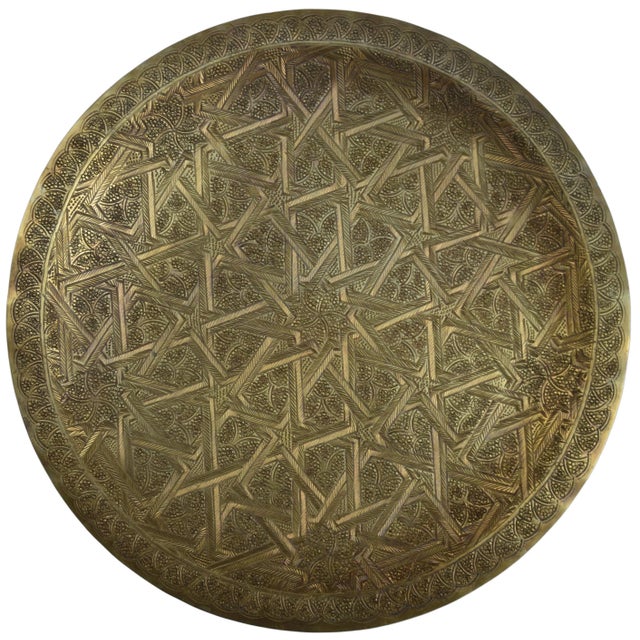 Mid-Century highly crafted, engraved and detailed Moroccan tray. Constructed of solid brass, engraved with remarkable...