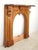 Late Victorian wood arched mantel in medium tones. A blend of scrollwork and geometric carvings mix traditional Victorian...