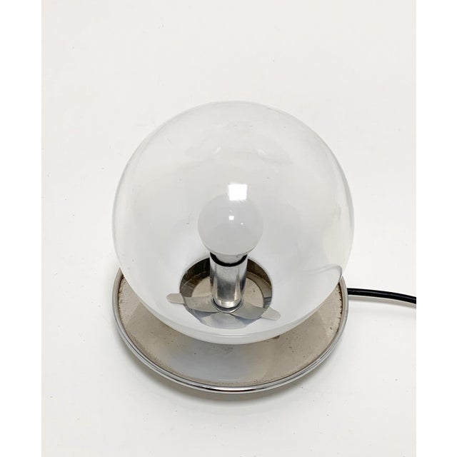 - Pair of table or bedside lamps - The base is chromed - Mounted Murano blown glass spheres - They mount a small E 14...