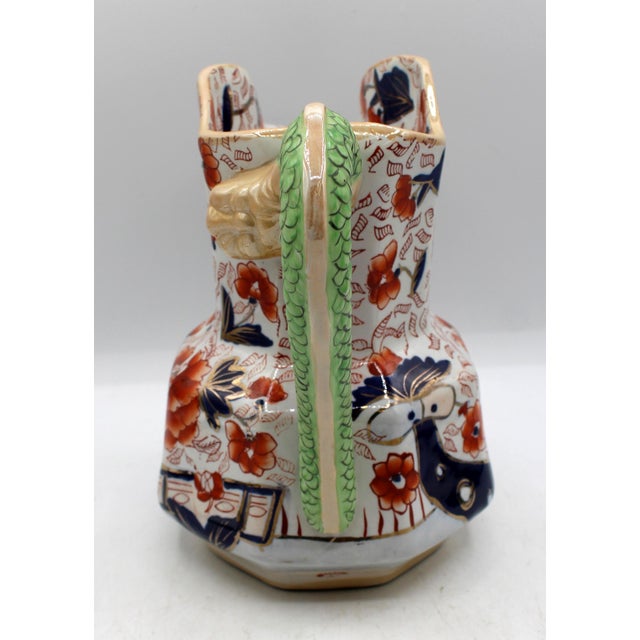 Early 20th century large Mason's Ironstone hydra handle pitcher, English. Imari influence decoration. Underglaze crown &...