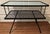 Very stylish Mid-Century modern side table with geometric pattern laminated acrylic top. Will elevate any outdoor space....