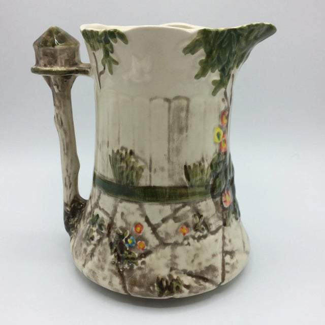 Beautiful English Majolica pitcher/jug made in Staffordshire England. Marked Flora & Fauna on bottom of jug. Garden scene...