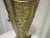 Mid century modern brass umbrella stand. This piece is heavily embossed with flowers and swans. It's in the shape of an...