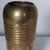 Modernist brass vessel with ridges. Made in India. Showing some signs of age and patina. Can be polished to shiny brass if...