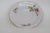 This lovely saucer is made of porcelain, and it is stamped on the bottom as being made by Wawel in Poland, see pictures....