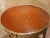 With its finely detailed marquetry top and richly ornamented gilt bronze mounts, this antique French Louis XVI style...