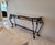 Monumental Spanish Revival console table dating to the late 20th or early 21st century, featuring an expansive shaped...