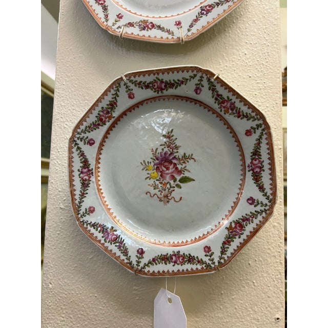 An unusual 18th century pair of Chinese Export hexagonal plates. They are decorated with European Botanicals of Purple,...