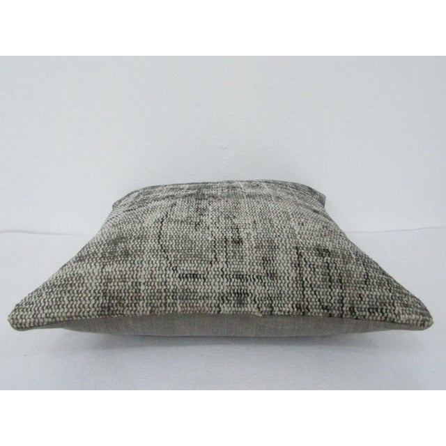 This is a pillow cover made from a vintage kilim rug. The piece was properly washed and ready to use. Pillow inserts not...