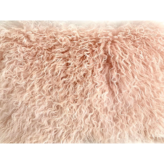 Premium luscious and silky pink Tibetan lambswool pillow backed in a neutral faux suede with zipper closure. Generous 95/5...