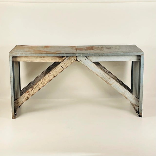 This piece makes a great entryway console, credenza, or work table. The patina and industrial look will make a striking...