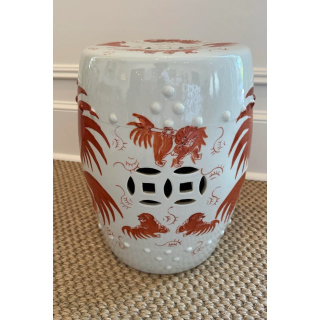 Beautiful vintage Chinese garden stool with hand panted orange/red dragon motif