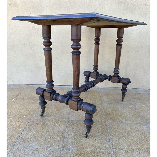 Wood 19th Century Victorian Walnut Table with Turned Base and Castors For Sale - Image 7 of 12