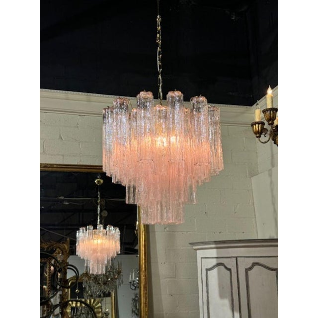 Modern Murano "tronchi" style pink glass chandelier. The chandelier has been professionally rewired, comes with matching...