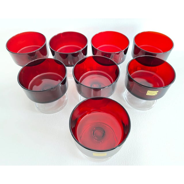 Vintage 1960s set of 8 French red glass coupes with clear bases. Some with original label. Marked.