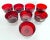 Vintage 1960s set of 8 French red glass coupes with clear bases. Some with original label. Marked.