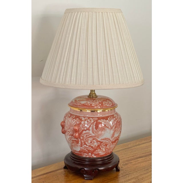 Very rare and pretty Asian orange and white table lamp on a dark brown footed base. Beautifully hand-painted in a fruit...
