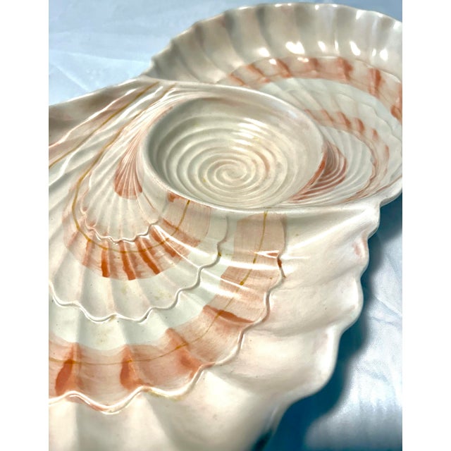A striking vintage serving piece by Fitz and Floyd, featuring a beautifully sculpted seashell design with organic form and...