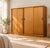 A freestanding double door teak sliding door wardrobe from Austinsuite Made during the 1960s Fitted out with clothes rail...