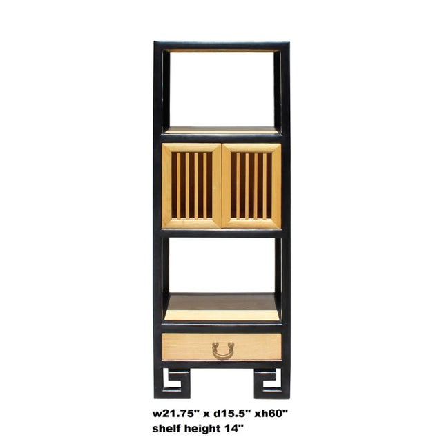 This is a simple display cabinet with open and closed sections. The surface is finished with black color rim and natural...