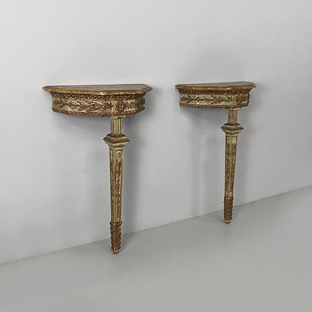Italian antique consoles in green and yellow wood, 1700s Pair of wall consoles in finely crafted wood, painted in green...