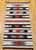 This vintage American Navajo rug features a striking striped design in a harmonious blend of earthy Southwestern tones,...