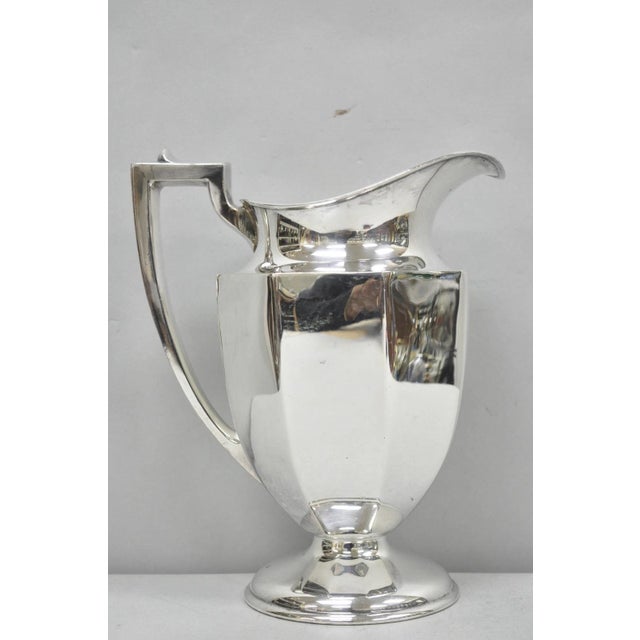 Vintage Art Deco Silver Plated Octagonal Faceted Water Pitcher by Homan Plate. Circa Mid 20th Century. Measurements: 10" H...
