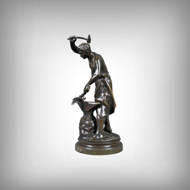 A bronze sculpture of great expressive intensity, adrien gaudez's *the blacksmith* powerfully and nobly embodies the...