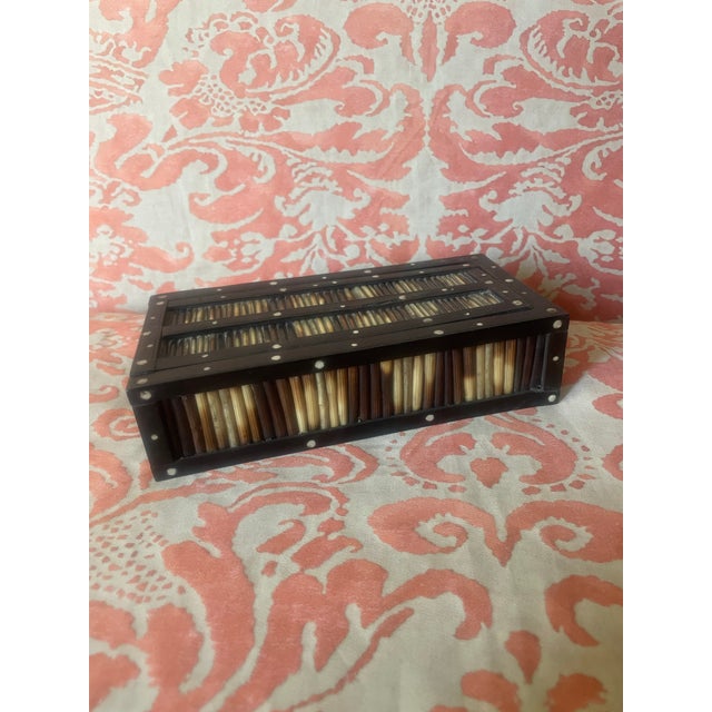 This beautiful box is covered in porcupine quills with small bone details. It is perfect for a catch all. Or on your desk...