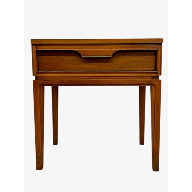 A vintage mid-century modern walnut side table by Basic Witz, Waynesboro, Virginia. This piece features clean modernist...