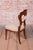 This set of four dining chairs is a magnificent example of refined bourgeois craftsmanship from the Biedermeier period...