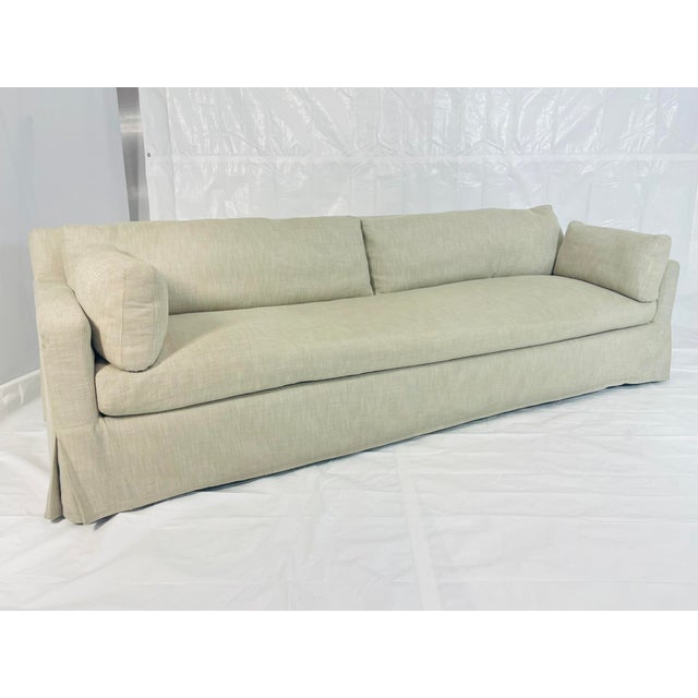 Inviting and elegantly understated, this oversized linen slipcover sofa by Restoration Hardware embodies modern comfort...