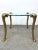 Rare vintage side table in the style of P.E. Guerin, featuring sculpted frond-style legs and a thick round glass top. The...