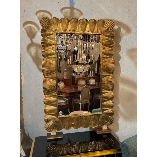 Beautiful modern gold Murano glass shell mirror. Creates a designer look! Pretty! 32w x 47h