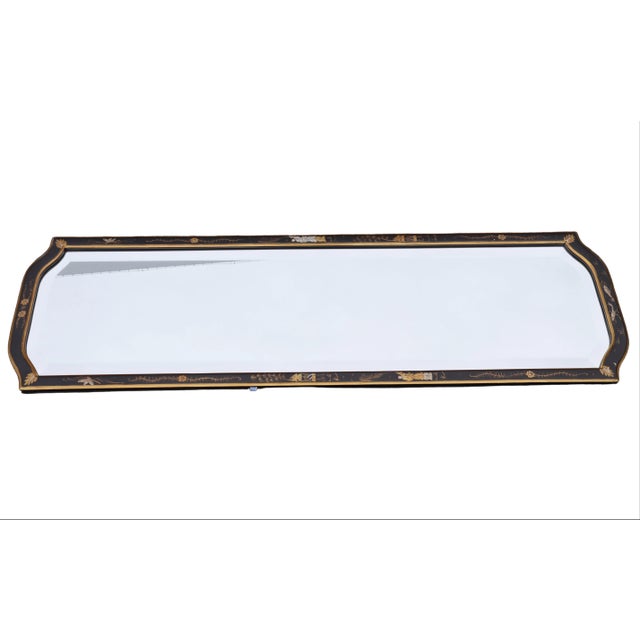 Exquisite Chinoiserie beveled mirror with black frame and gold accents. Delicate painted details include floral motifs,...