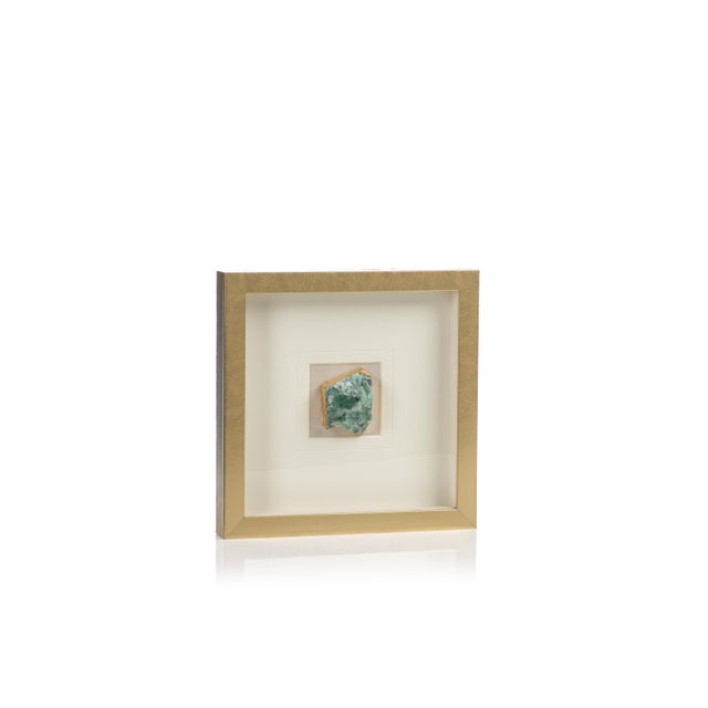 Add an elegant touch to your décor with this very unique framed crystal. The natural crystal wrapped in gold foil gives a...